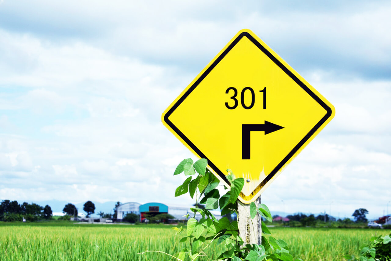 text of number 301 and arrow traffic signs on yellow board